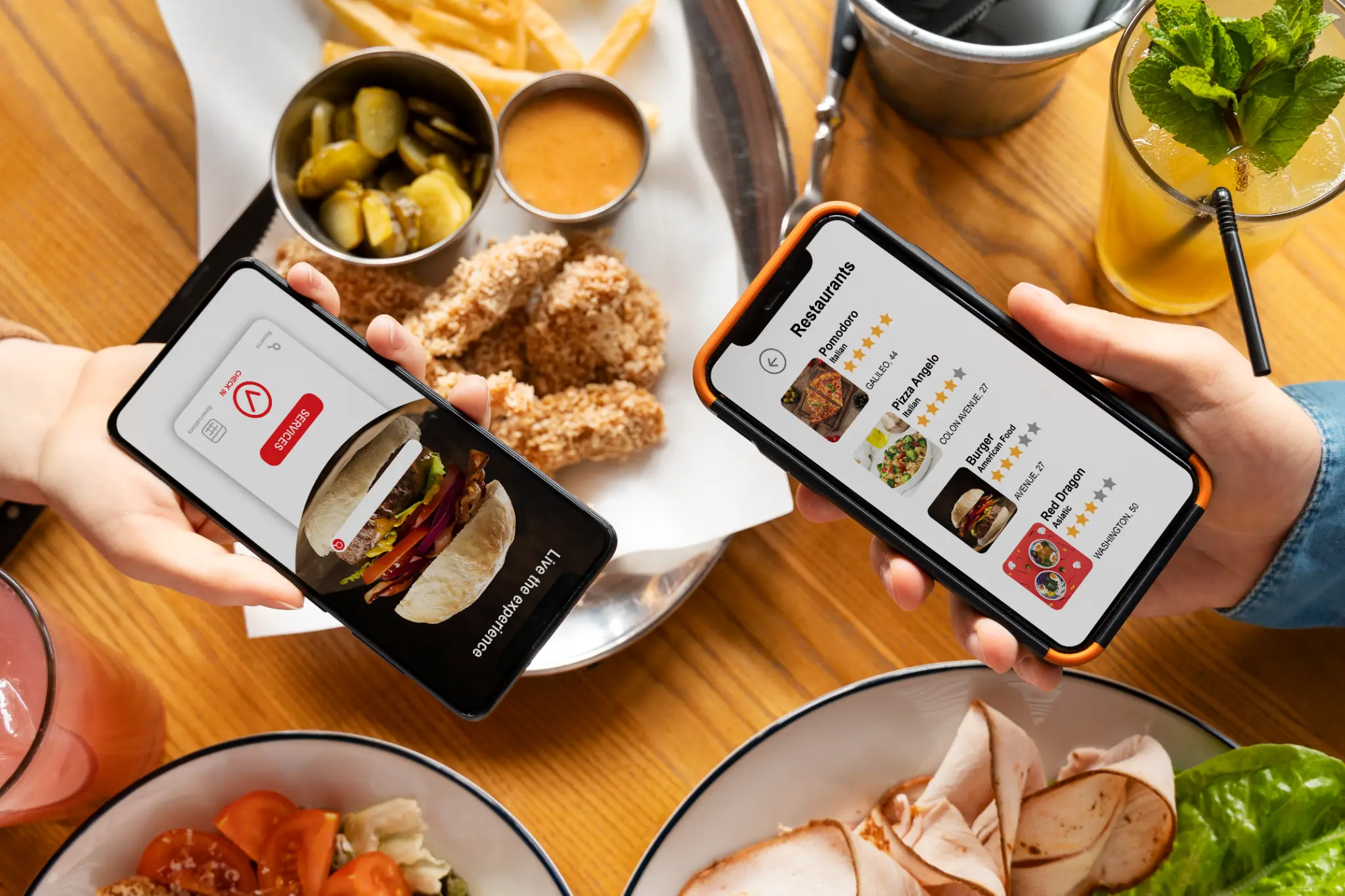 People using digital menus on tablets while dining